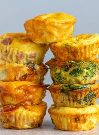Healthy breakfast egg muffins filled with vegetables and protein.